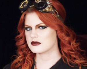 Ashley of Hollywood Noir Makeup wearing a steampunk inspired gold and brown smokey eye